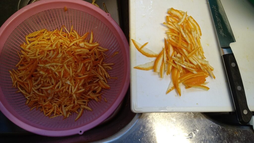 Thinly sliced citrus peel prepared for traditional marmalade